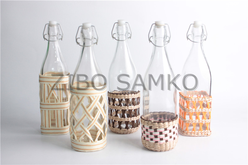 Glass bottle with wicker base