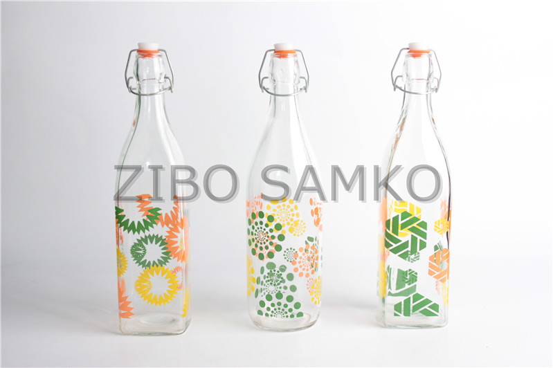Glass bottle with decal